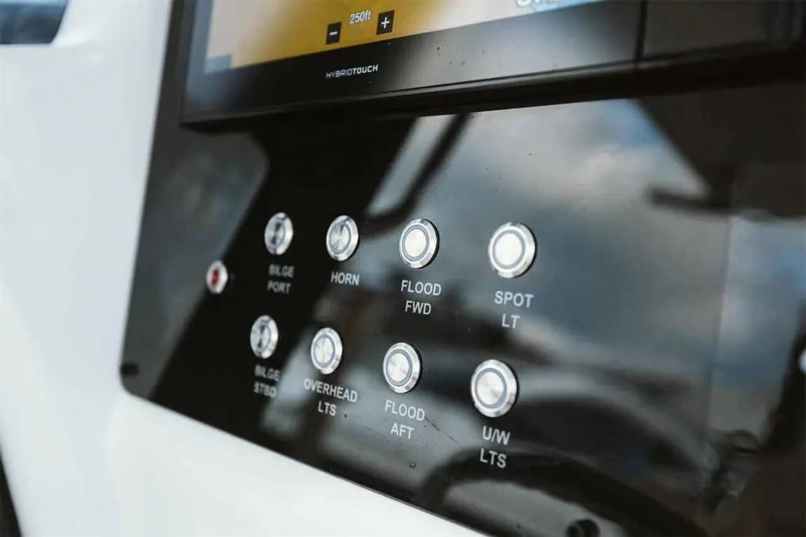 Control panel featuring buttons for bilge, horn, flood lights, and a screen indicating depth of 250ft.
